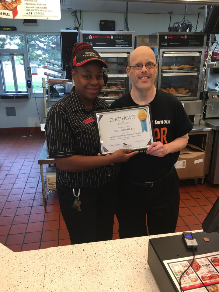 Presenting KFC with workplace diversity certificate. 